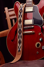 1968 Navajo Thinline whiskey suede guitar strap